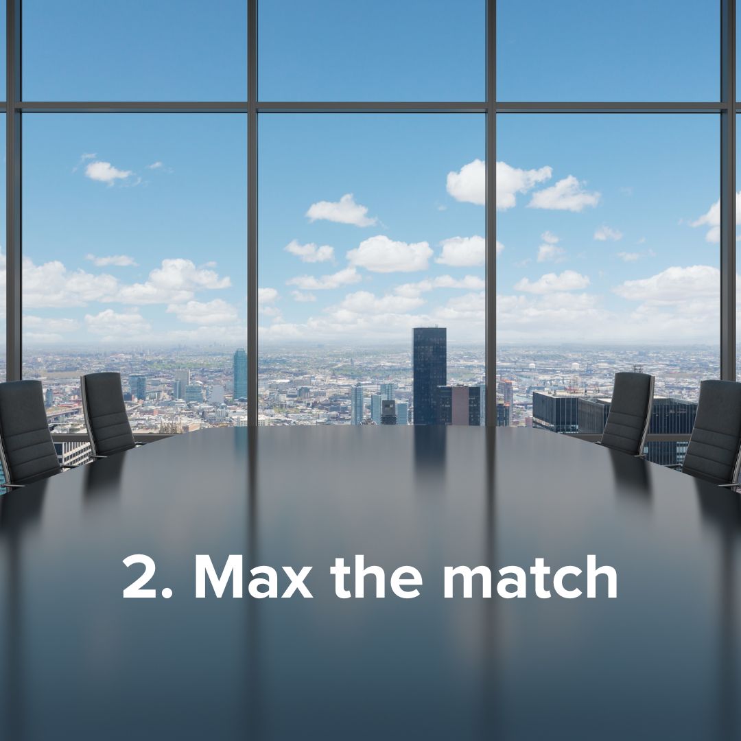 Large boardroom on the upper floor of a skyscraper with a view of a city on a partly cloudy sunny day. There's a large, dark, reflective table with the following title in white font: '2. Max the match'
