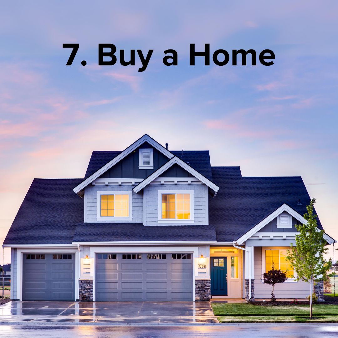 A modern craftsman gray home with gray trim in front of a pink cloudy sky. The black title at the top says: '7. Buy a Home'