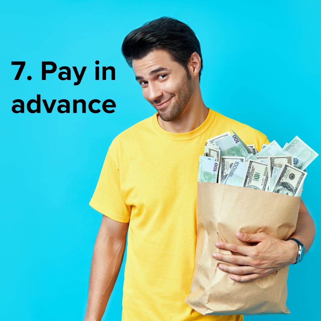 Title in black font in the upper-left: '7. Pay in advance' A man in a yellow shirt with a smug look holds a shopping bag full of cash. He stands in front of a blue background.