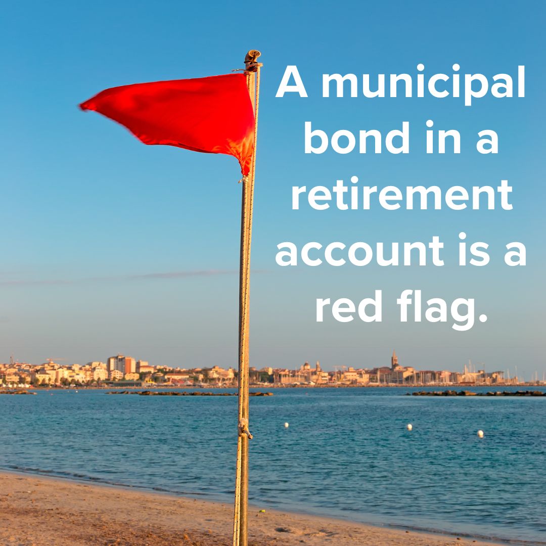 Title 'A municipal bond in a retirement account is a red flag.' on white on the right. Photo of a red flag in front of a body of water and a city in the background on a sunny day.