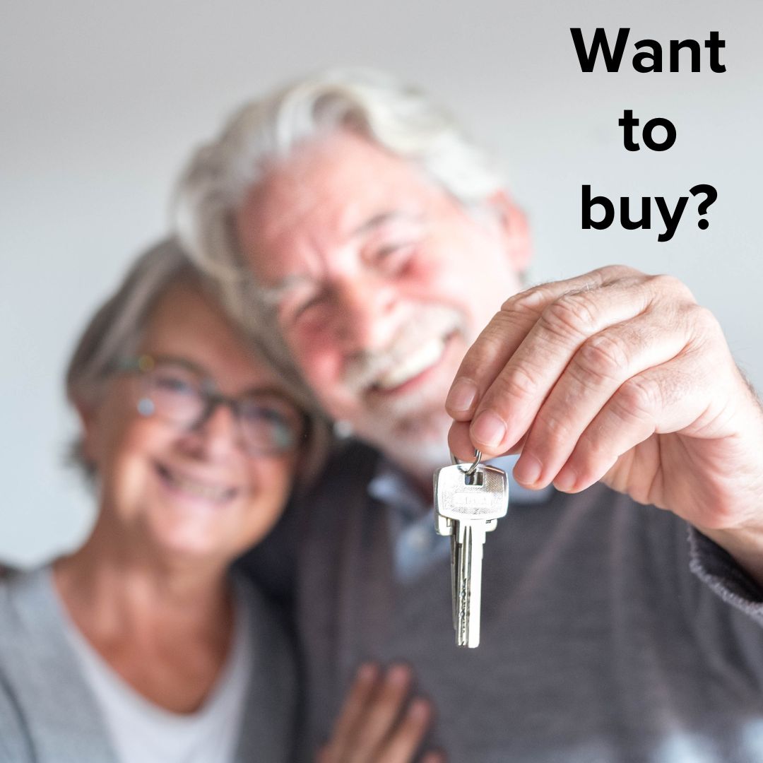 Title 'Want to buy?' in the upper-right. An older couple is smiling and holding a house key in the background.