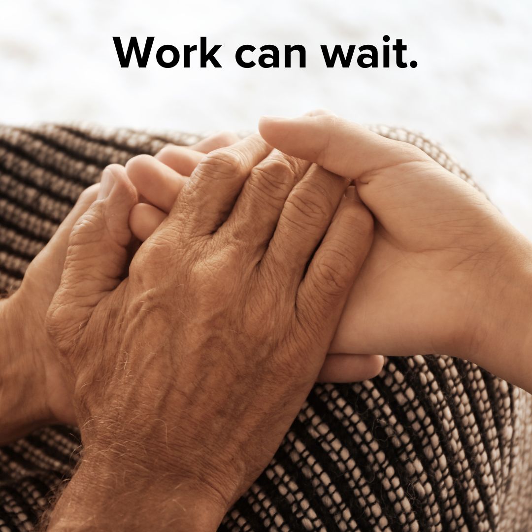 Title: 'Work can wait.' in black on top. Below it, two older hands hold a younger person's hand on either furniture or a blanket.